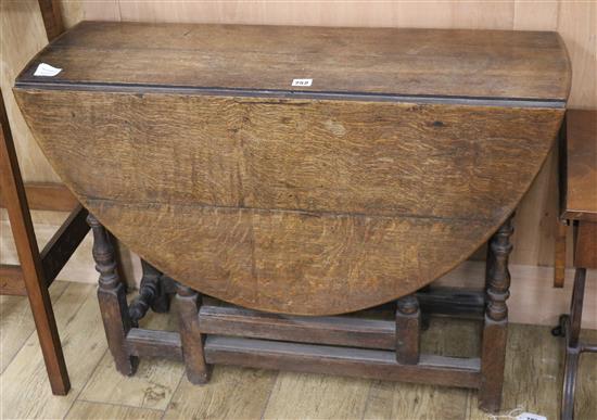An 18th century oak gateleg table, with drawers W.95cm